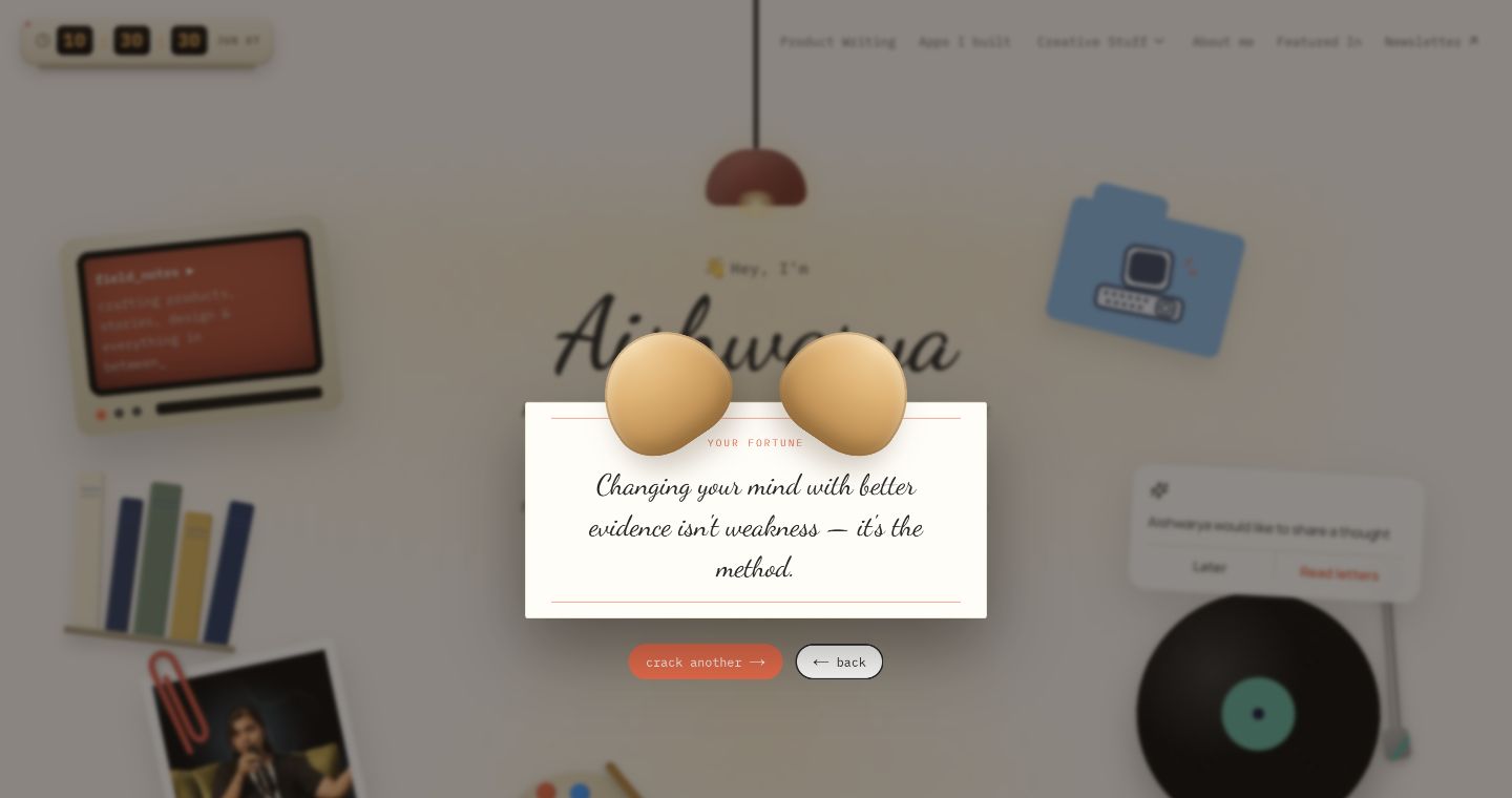 A screenshot of the hidden desk drawer with a cracked fortune cookie and fortune slip.